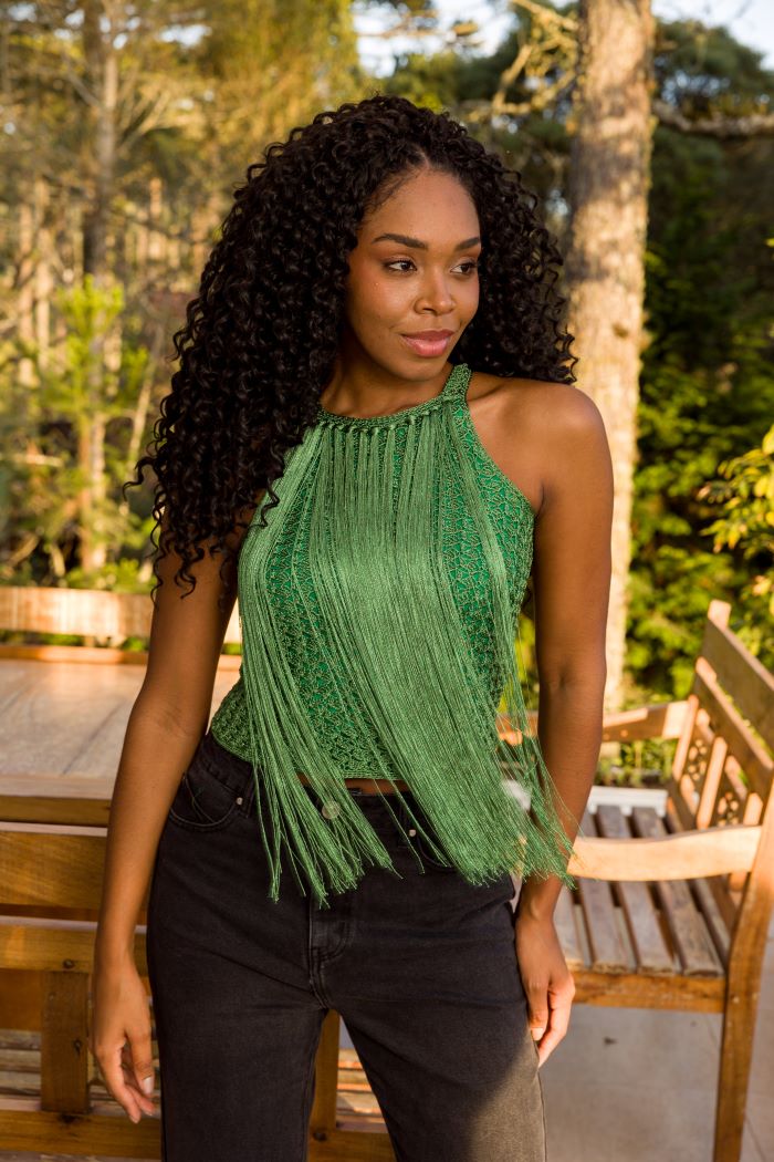 Circulo Cordone 100% Polyamide Crochet Yarn, 450 m / 100 g - Woman wearing a green fringe top outdoors with trees in the background