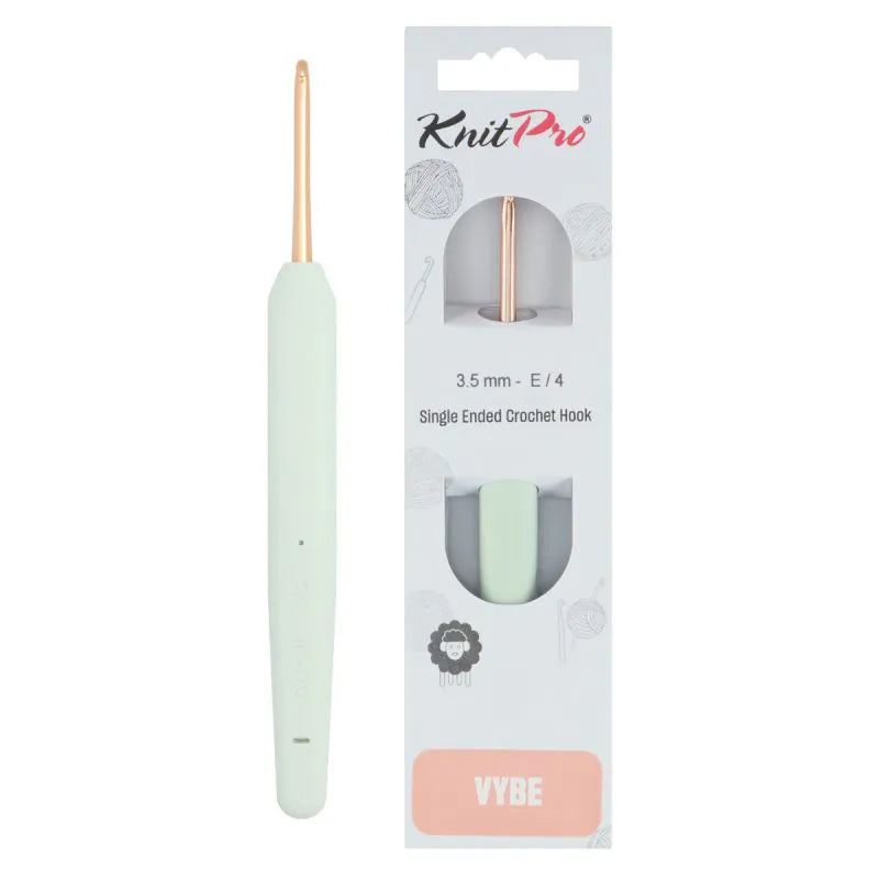 KnitPro Vybe single ended crochet hook in size E/4 (3.5 mm) in a pale mint green color with a rose gold metal tip, shown next to its retail packaging card