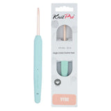 A KnitPro Vybe single ended crochet hook  4mm in the colorway 'Vybe' shown next to its retail packaging. The crochet hook features a light pastel blue handle and a rose gold metal tip.